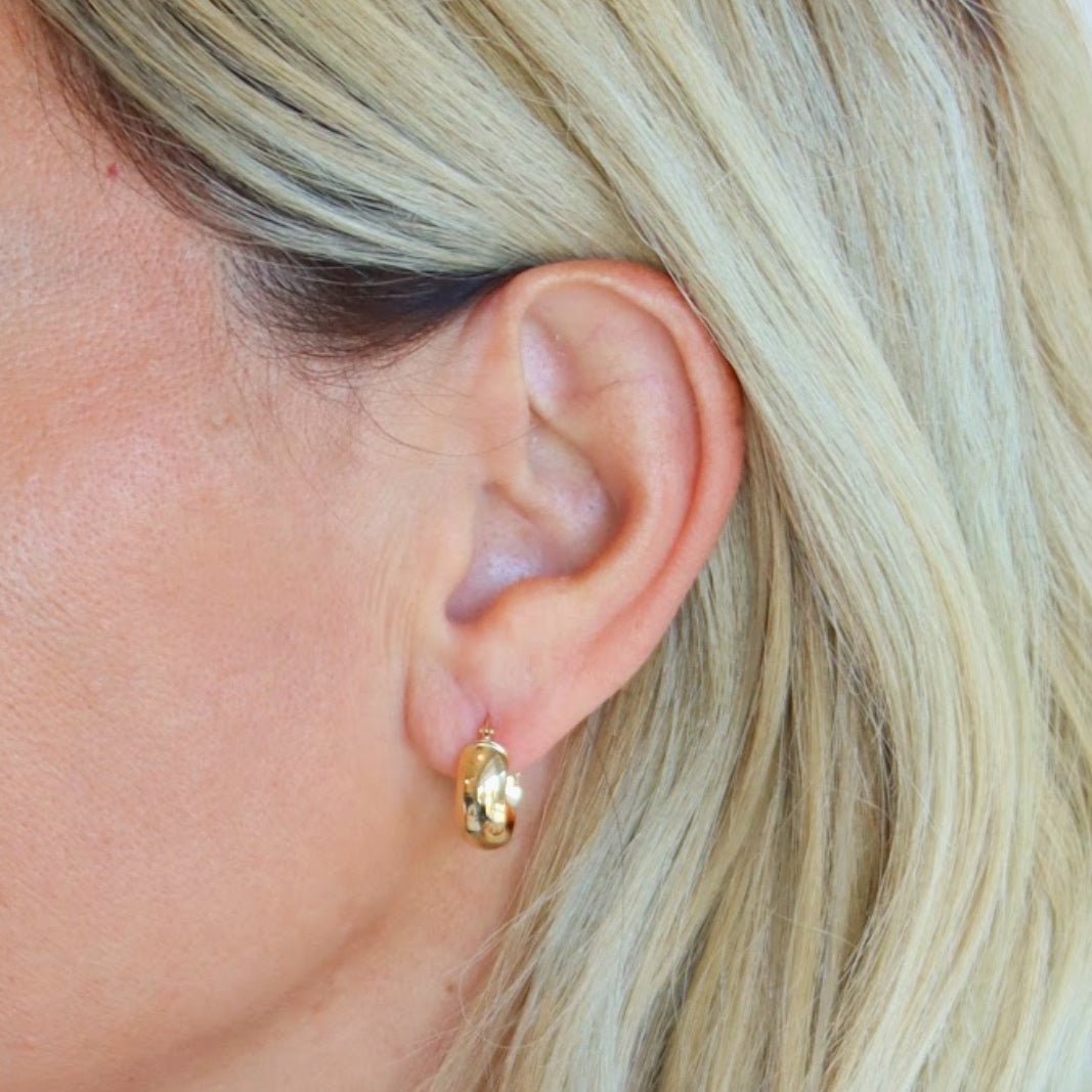Wearing Bold Huggie Hoops Earrings