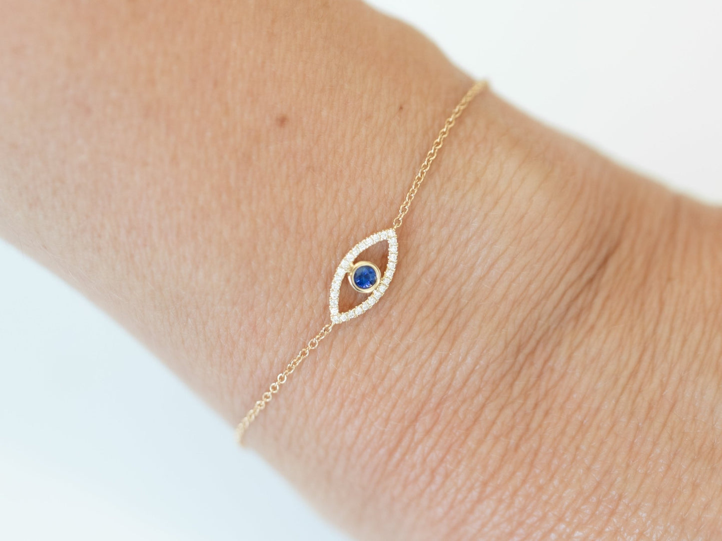 Wearing Diamond & Sapphire Evil Eye Bracelet