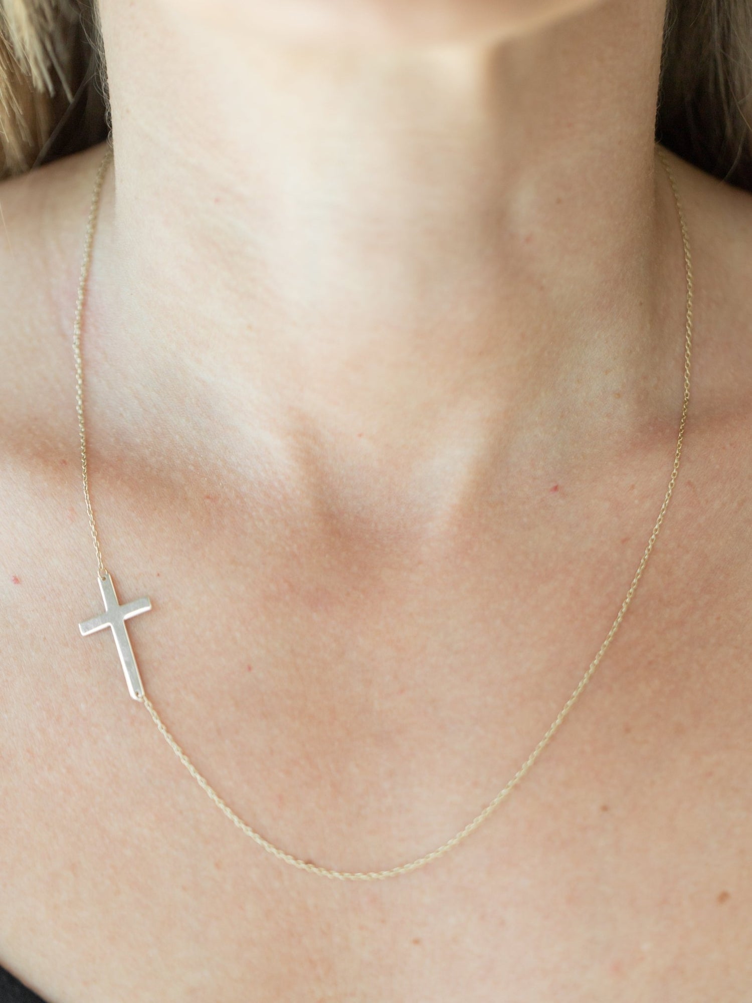 Wearing Asymmetric Cross Necklace