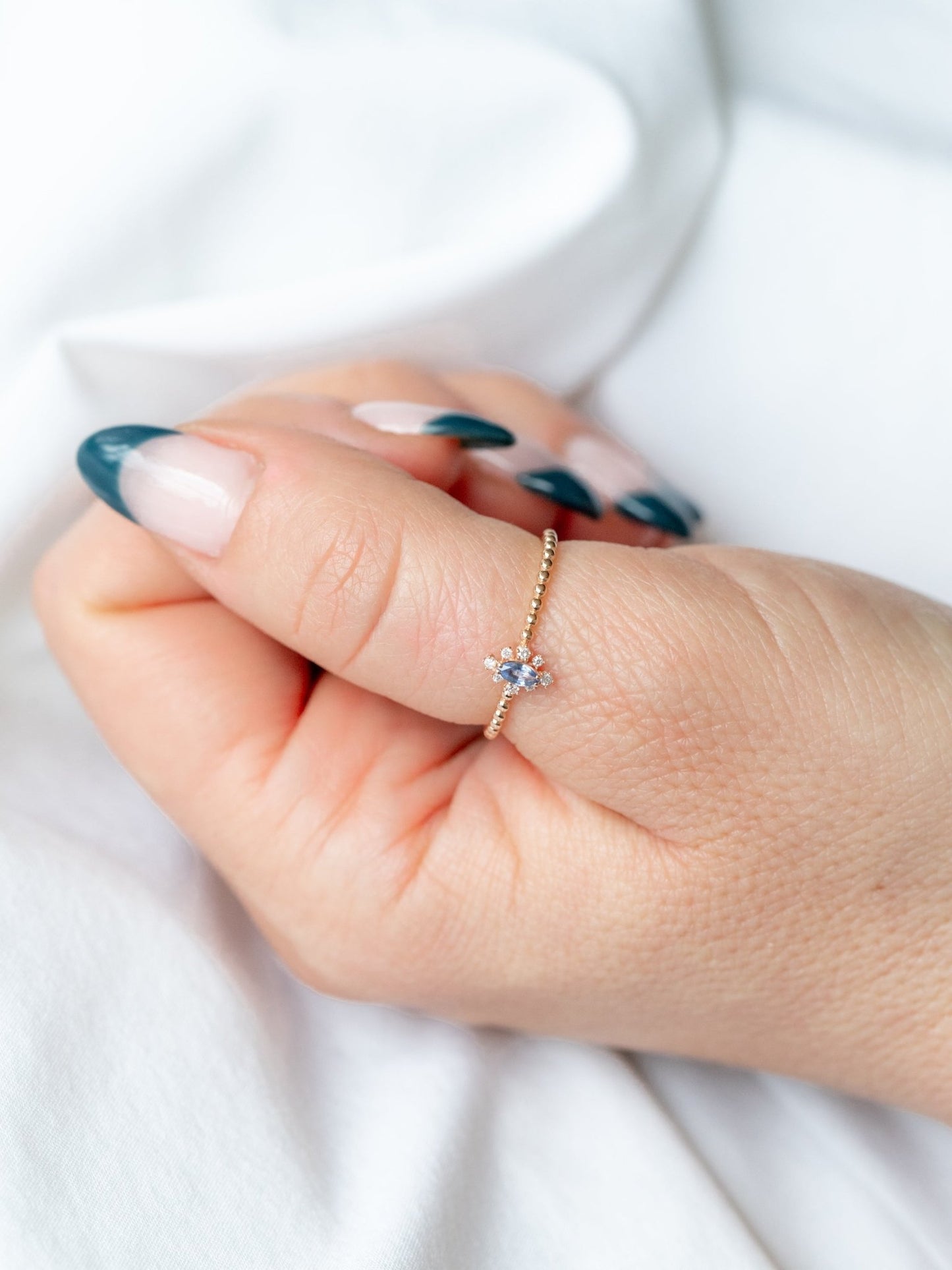 Wearing Anna Marquise Blue Topaz Bead Ring