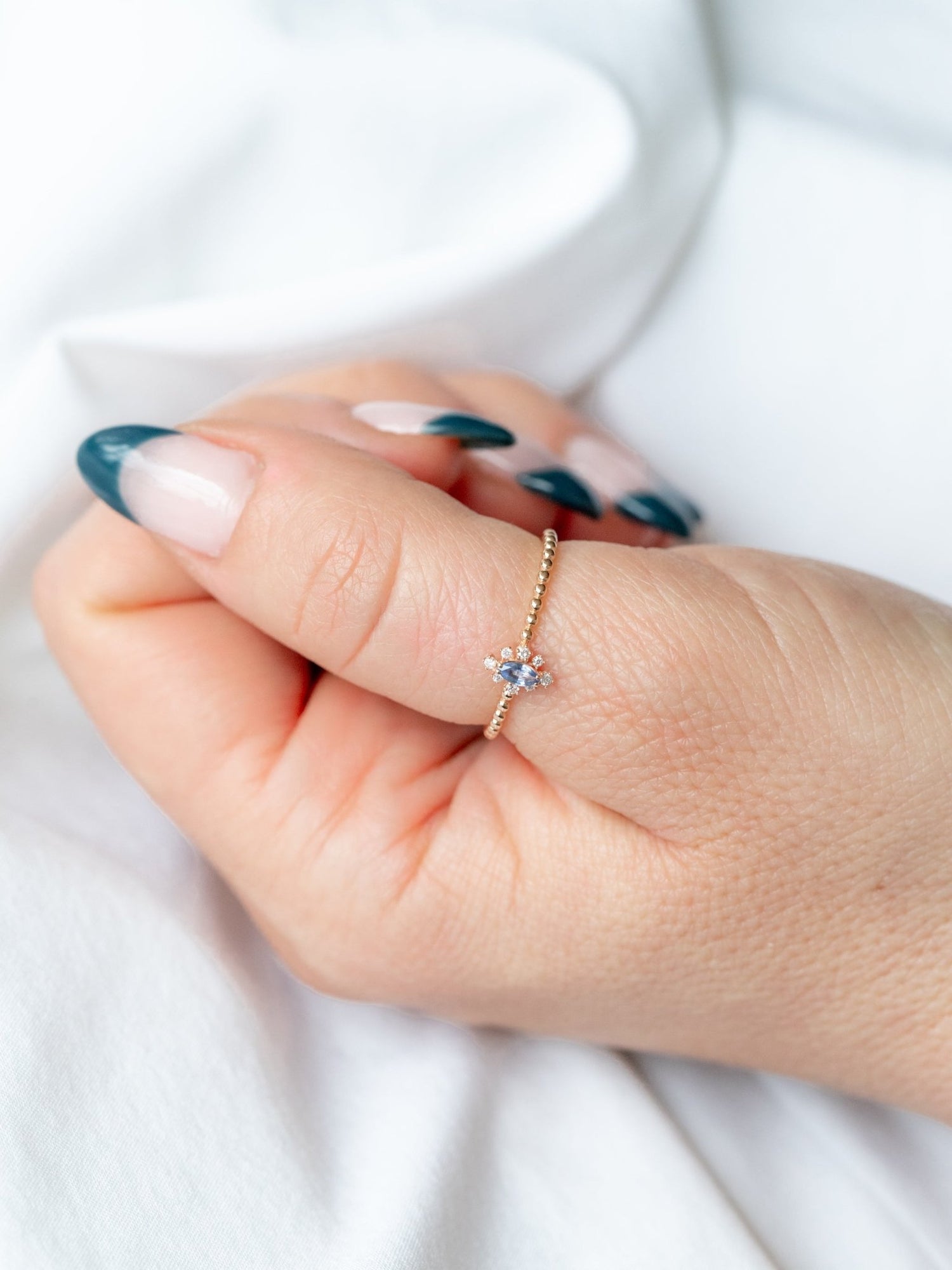 Wearing Anna Marquise Blue Topaz Bead Ring