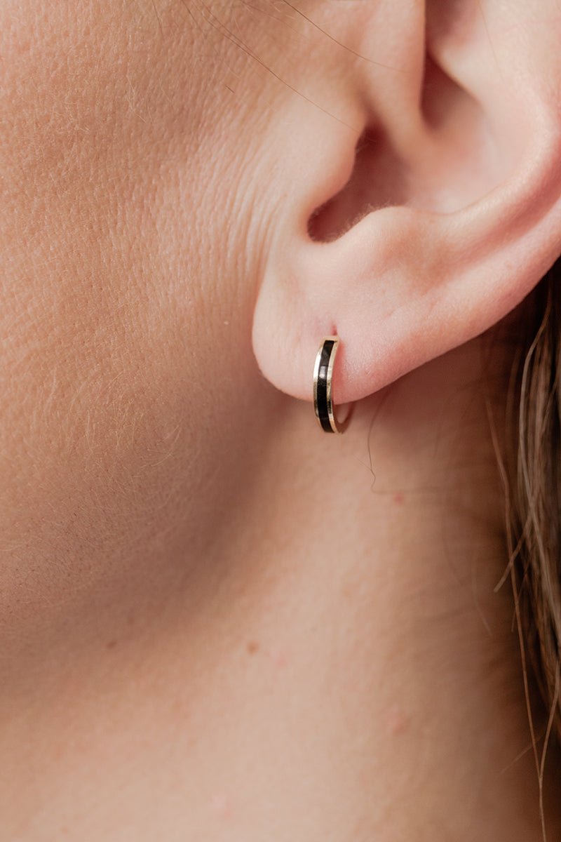 Wearing Black Enamel Gold Single Huggie Earrings