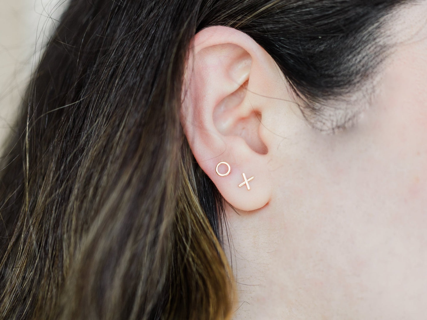 Wearing Mini Hugs and Kisses Studs