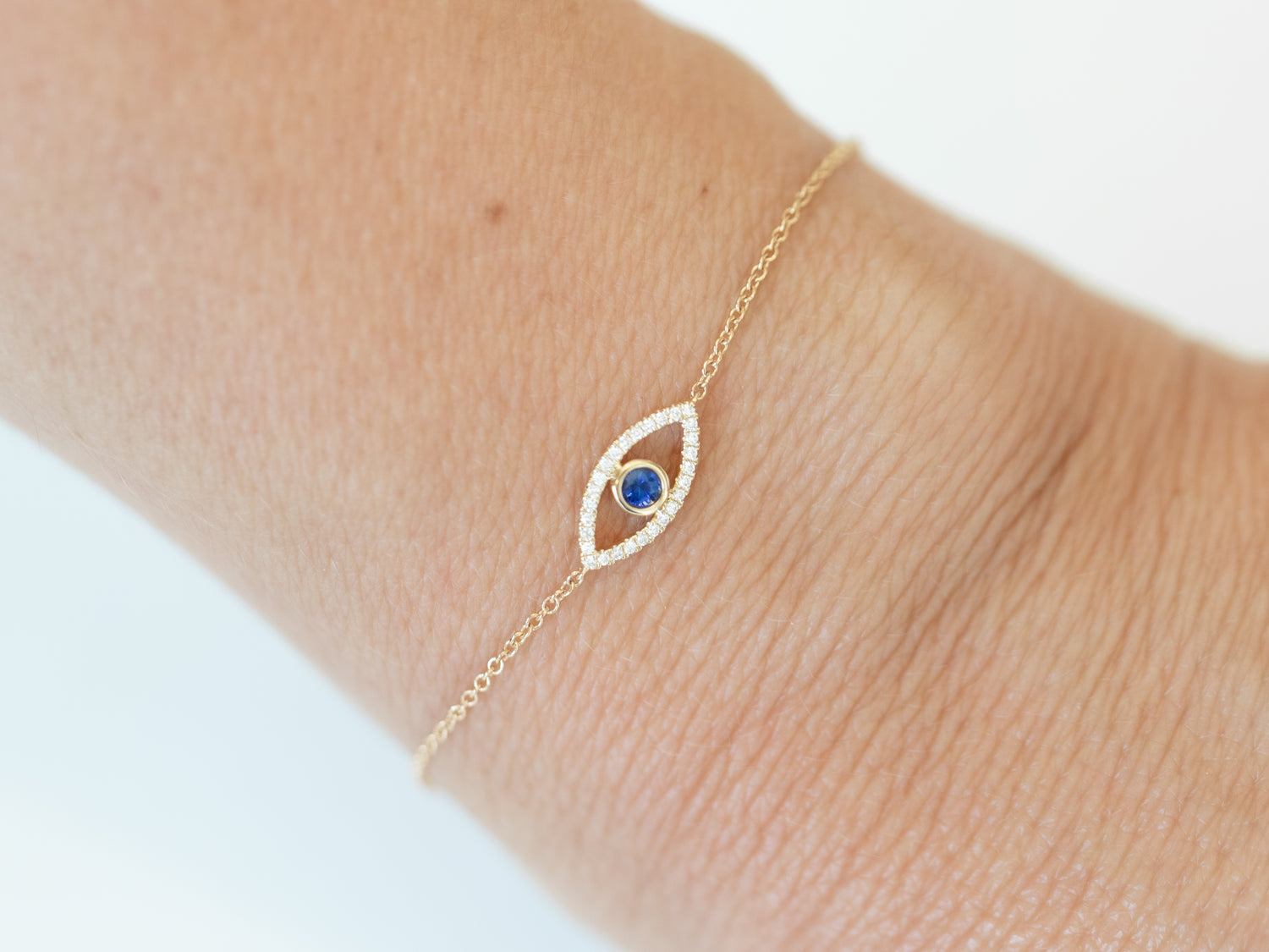 Wearing Diamond & Sapphire Evil Eye Bracelet