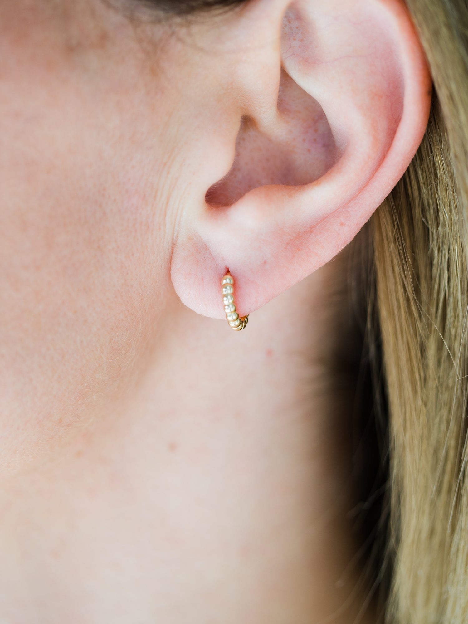 Wearing Mini Bead Huggie Hoop Earrings