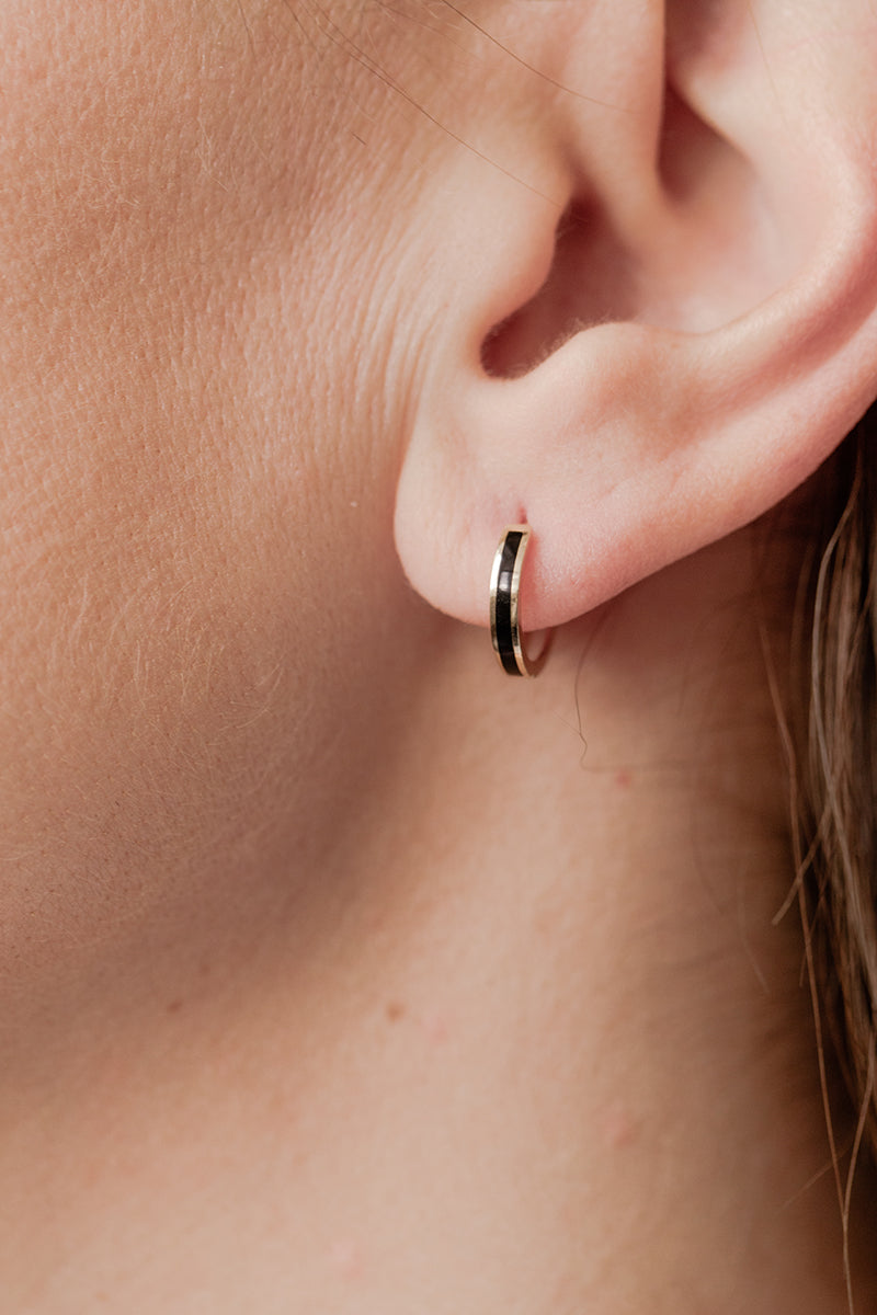 Wearing Black Enamel Gold Single Huggie Earrings